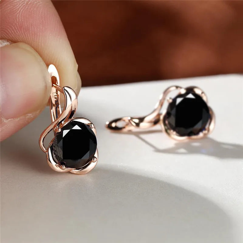 Rainbow cubic zirconia floral mystical earrings with arc-shaped design, crafted by Corporación Turística, showcasing vibrant, sparkling jewelry.