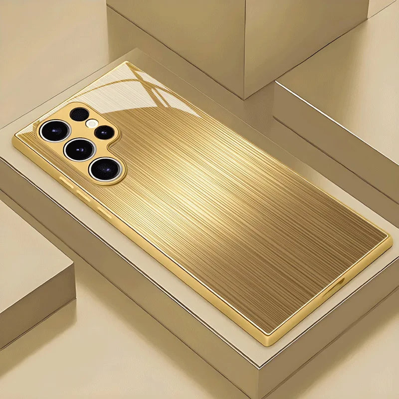 Tempered glass phone case with gold finish, designed for smartphones, featuring a sleek, reflective surface and stylish protection.