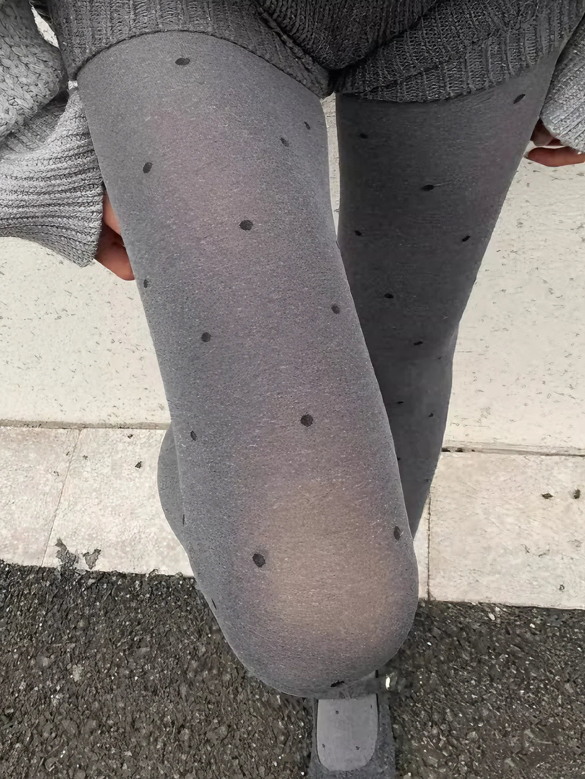 Gray vintage knit tights with small dotted pattern from Corporación Turística, showing the textured fabric and delicate design.