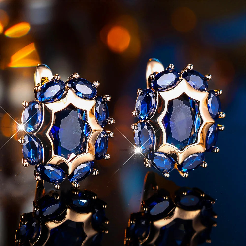 Oval cubic zirconia hoop earrings for women, stylish jewelry by Corporación Turística, featuring sparkling stone accents.