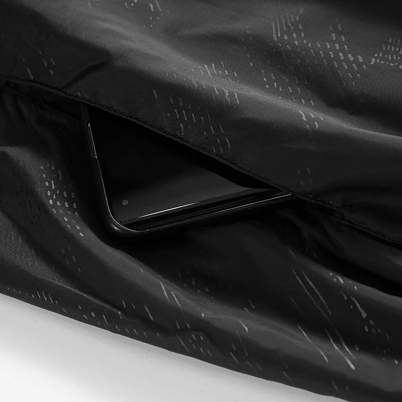 Unisex hiking waterproof jacket from JNLN by Corporación Turística, shown in a lightweight, durable design ideal for outdoor activities.