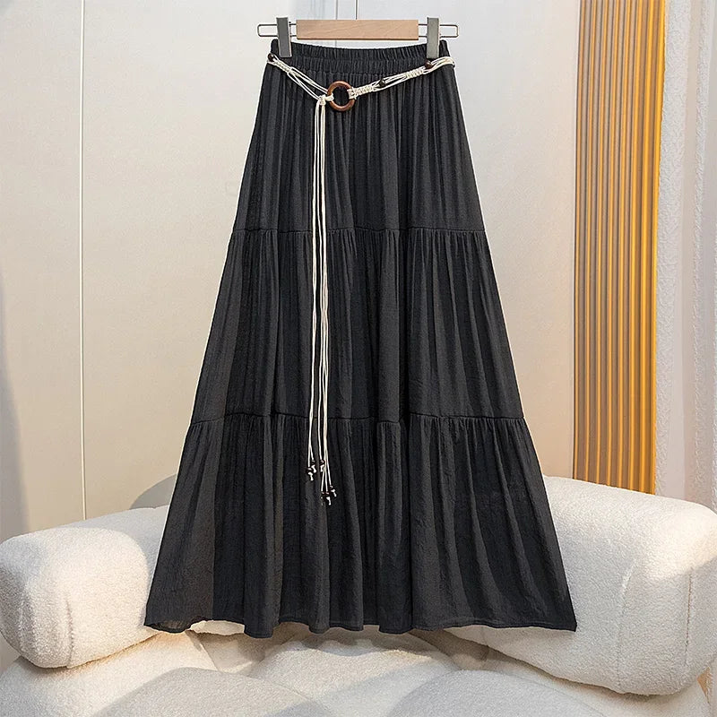 Long boho midi summer skirt made of cotton and linen by Corporación Turística, featuring a flowy, relaxed fit in natural fabric tones.