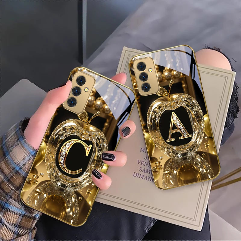 Gold crystal phone case with letter 'A' for smartphones, featuring a stylish and protective design from Corporación Turística.