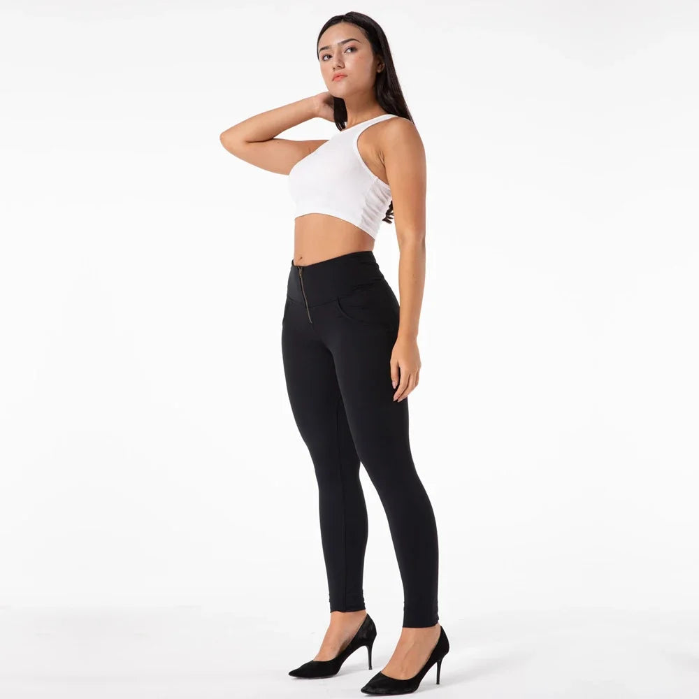 High-waisted black Melody leggings by Corporación Turística, featuring a snug fit and smooth fabric for comfortable wear.