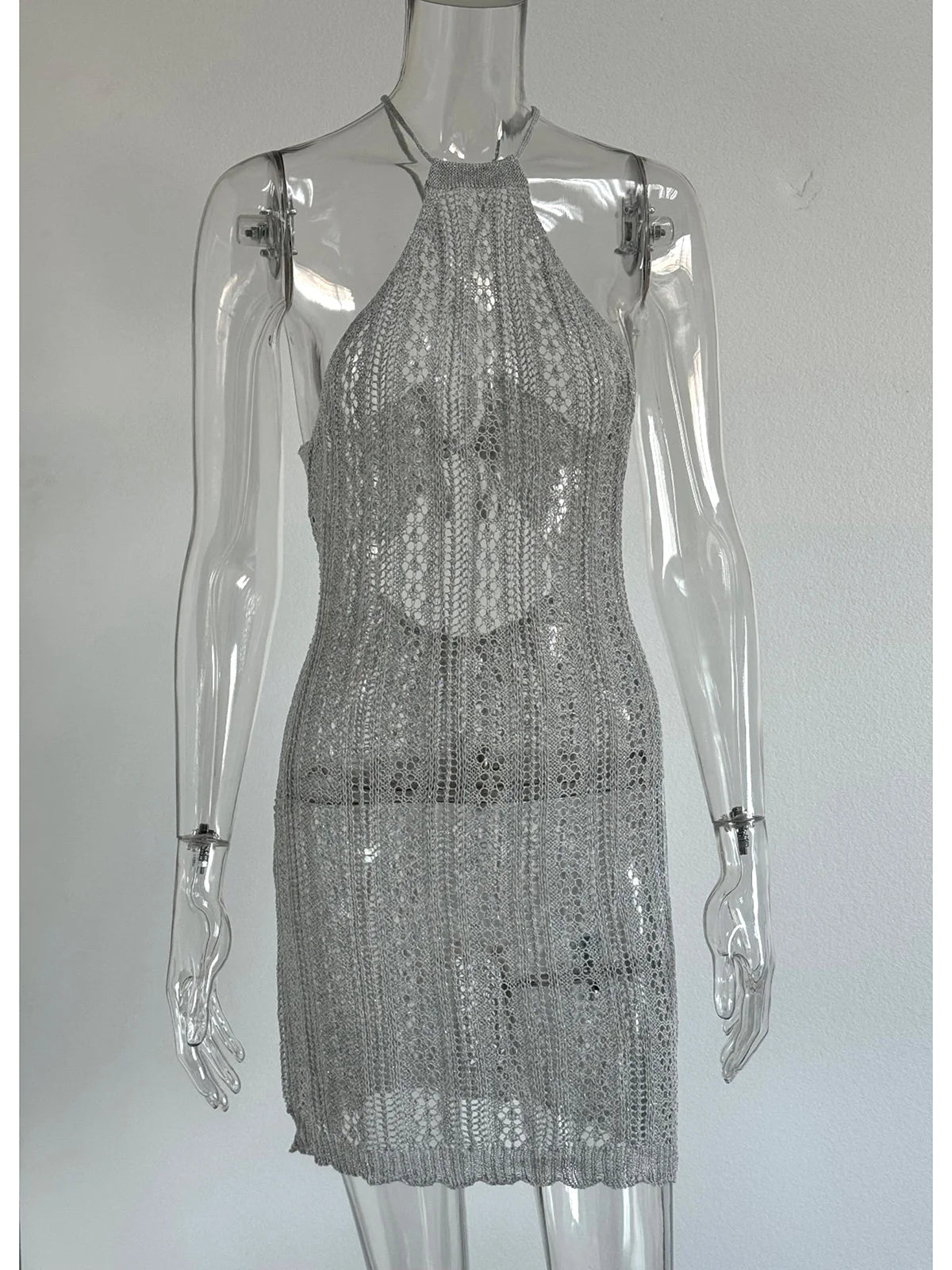 Knitted crochet tunic with an open back from Corporación Turística, featuring intricate stitch details and a relaxed fit.