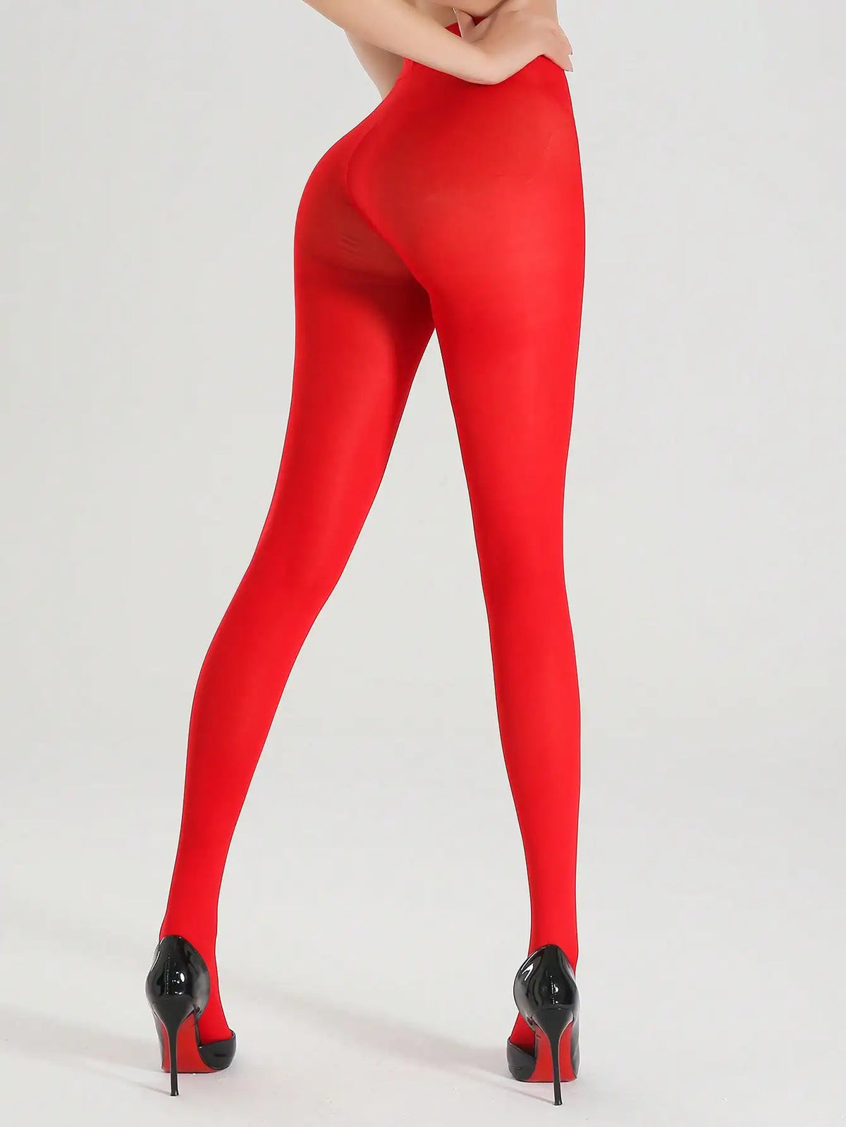 Pair of opaque red ultra-elastic nylon pantyhose from Corporación Turística, shown laid flat on a white background.