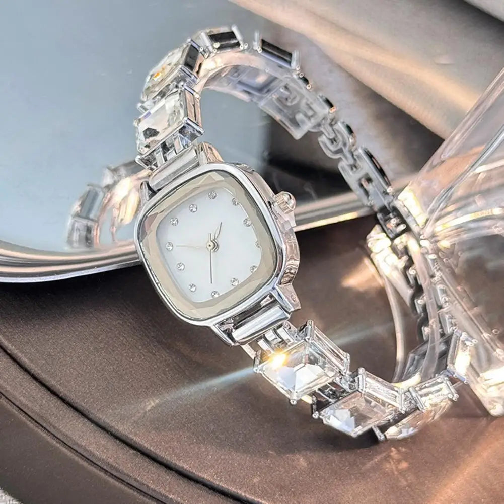 Elegant women's wristwatch with a sparkling square dial by Corporación Turística, featuring a stylish and modern design.