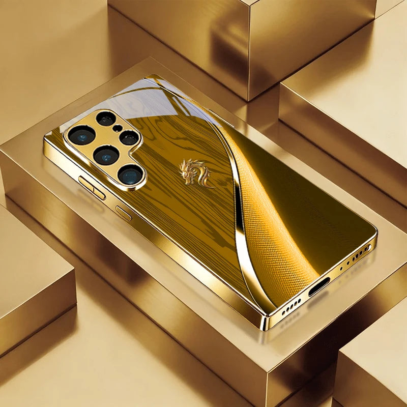 Golden galvanize phone case with dragon design by Corporación Turística, featuring detailed embossed dragon imagery.