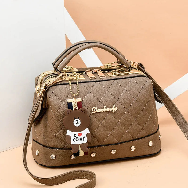 Small square high-quality women's handbag from Corporación Turística with a sleek design and elegant appearance.