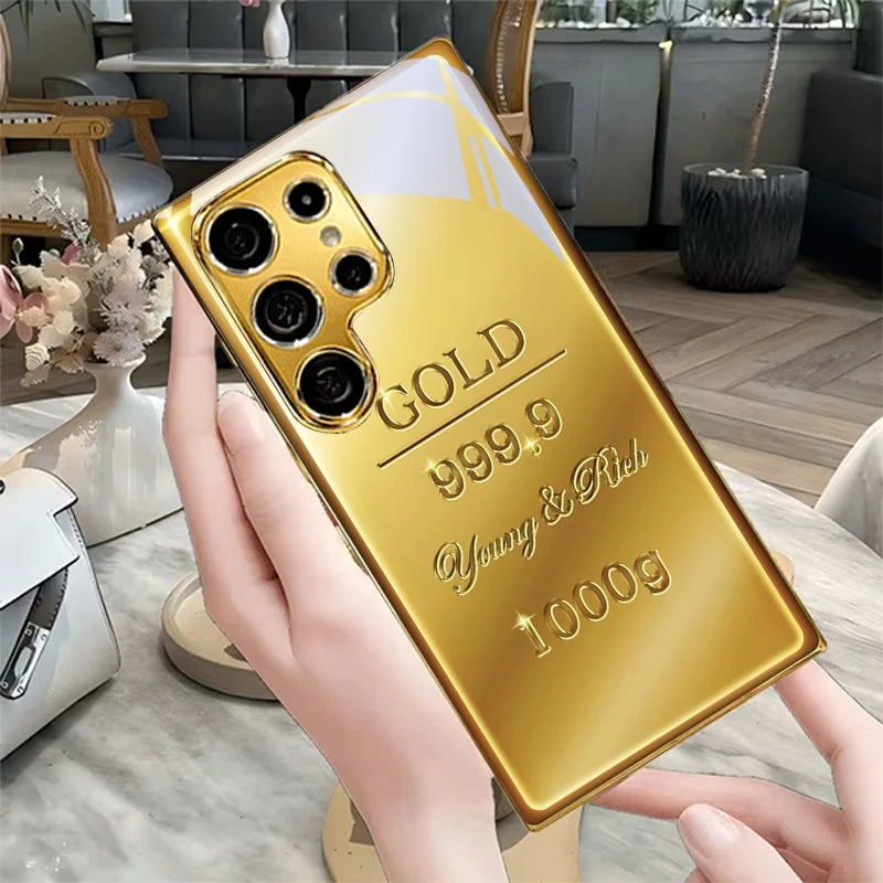 Luxurious gold phone case with bar design, stylish and protective, by Corporación Turística, shown on a smartphone.