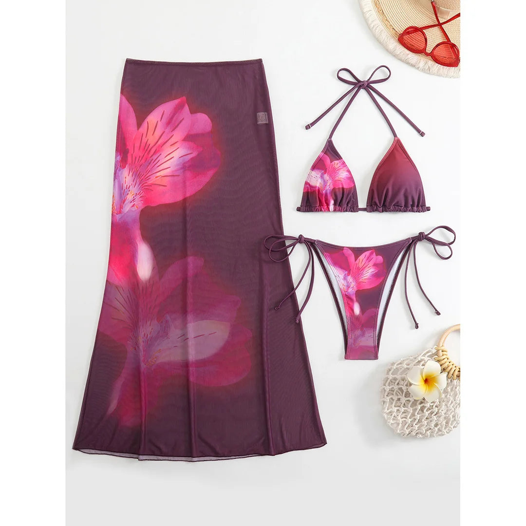 Colorful floral bikini with matching skirt, stylish swimwear from Corporación Turística, perfect for beach or poolside wear.