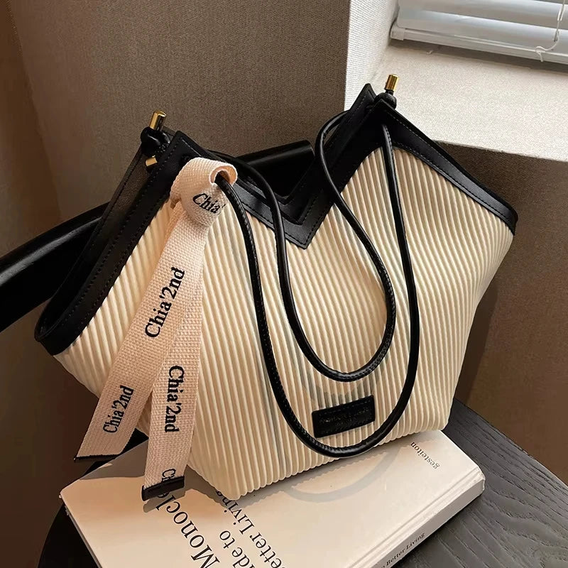 Large Korean-style women's tote bag made of durable canvas with spacious interior and fashionable design.