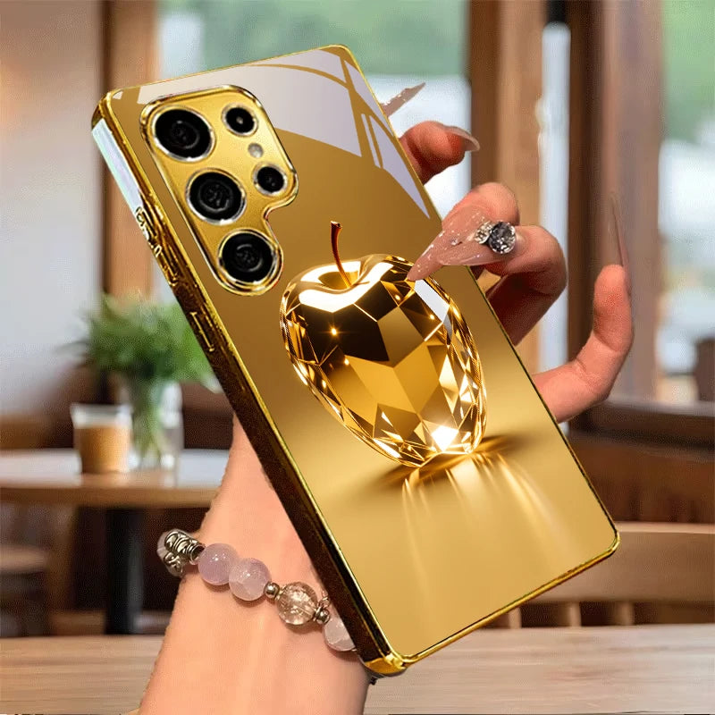 Golden phone case with geometric fruit design, featuring vibrant colors and modern style, by Corporación Turística.