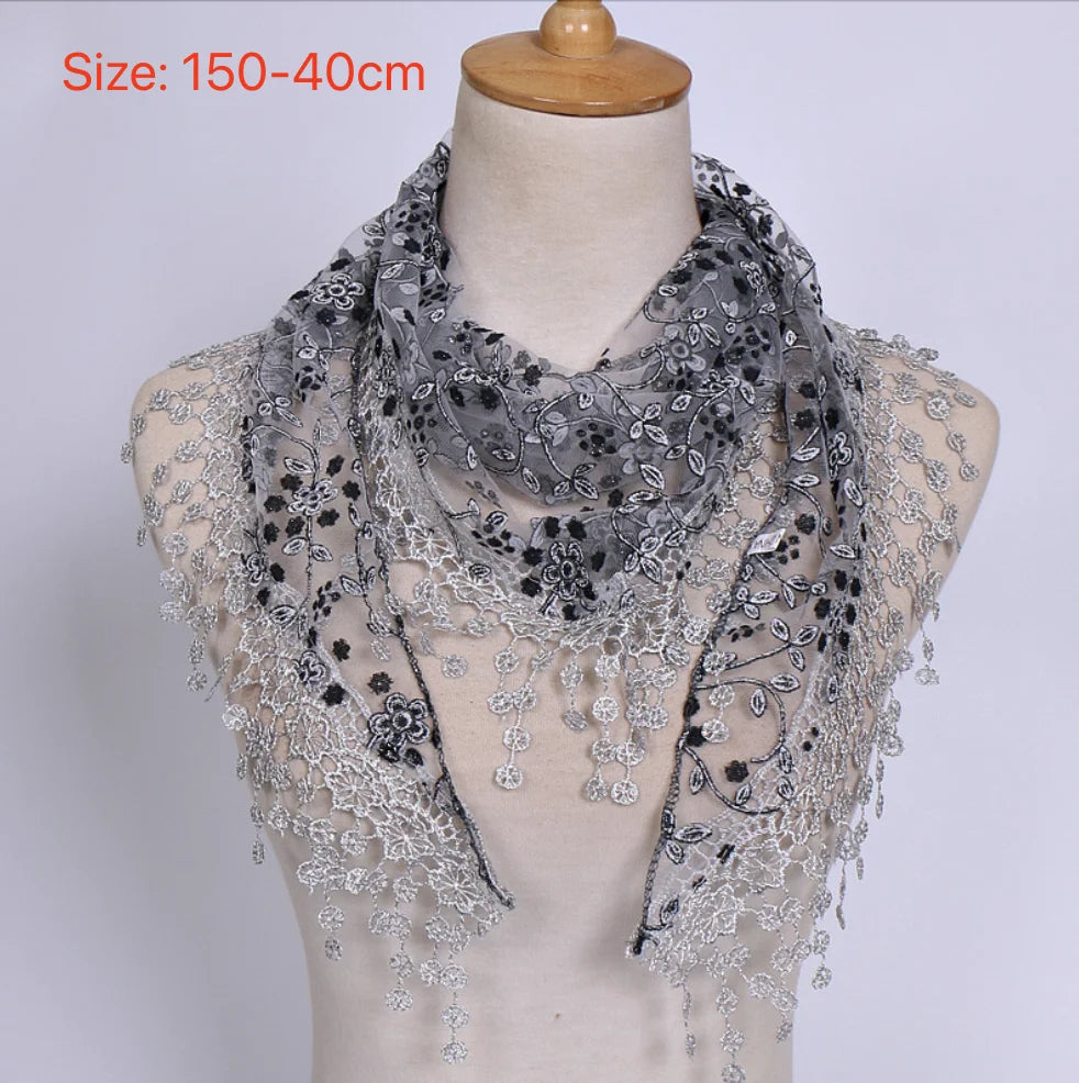 Shimmering short sequin top for women with oriental-inspired design, featuring reflective silver sequins and a stylish cut.