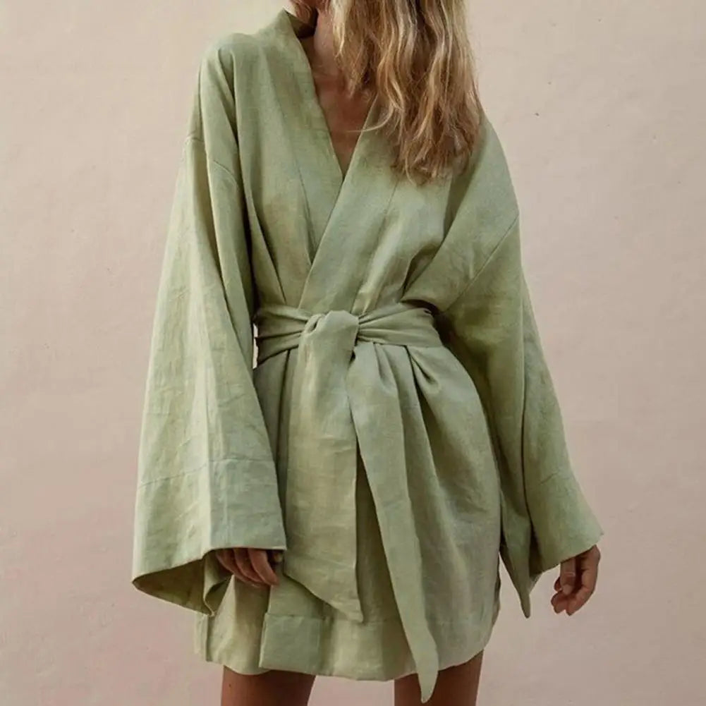 Long sleeve V-neck minivestido with drawstrings from Corporación Turística, featuring a stylish and comfortable design.