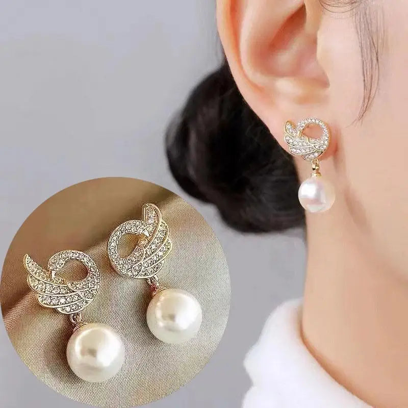 Pendientes de cisne de cristal hueco de aguja de plata 92...