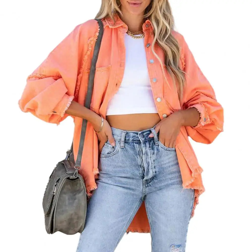 Oversized women's denim jacket by Corporación Turística, casual streetwear style with front pockets and button closure.