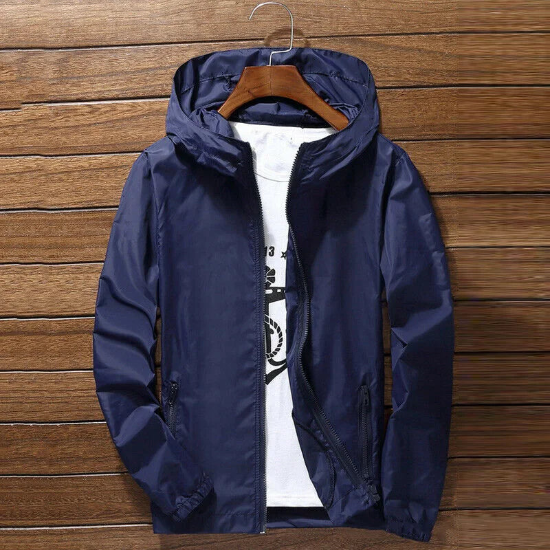 Lightweight quick-drying cycling and running jacket by Corporación Turística with waterproof and breathable fabric, shown on a hanger.