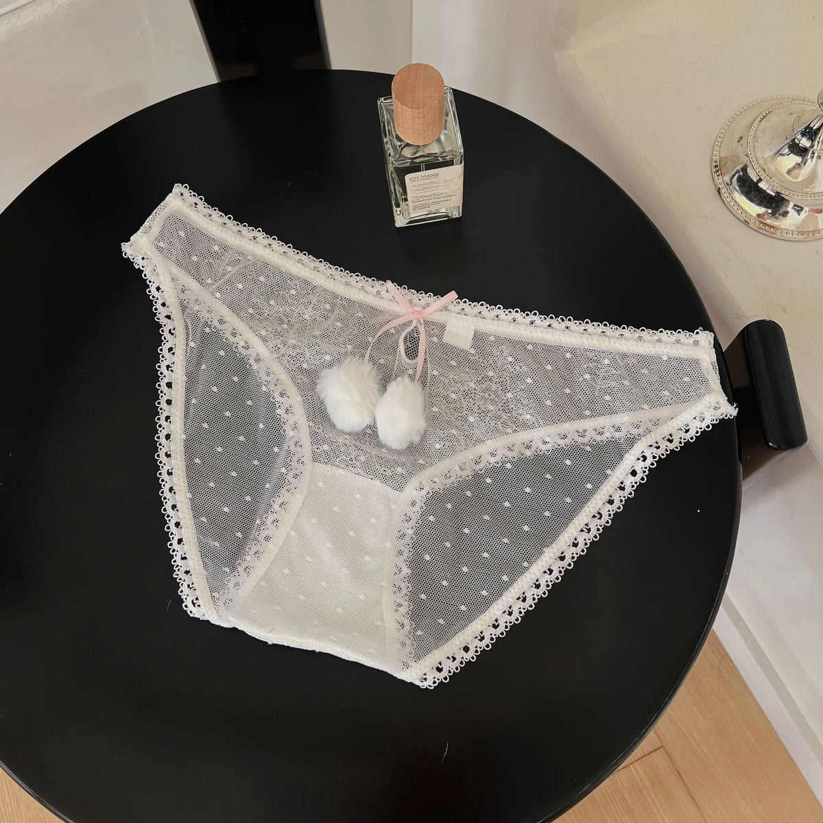 Transparent mesh panties with decorative bow, stylish and comfortable lingerie by Corporación Turística.