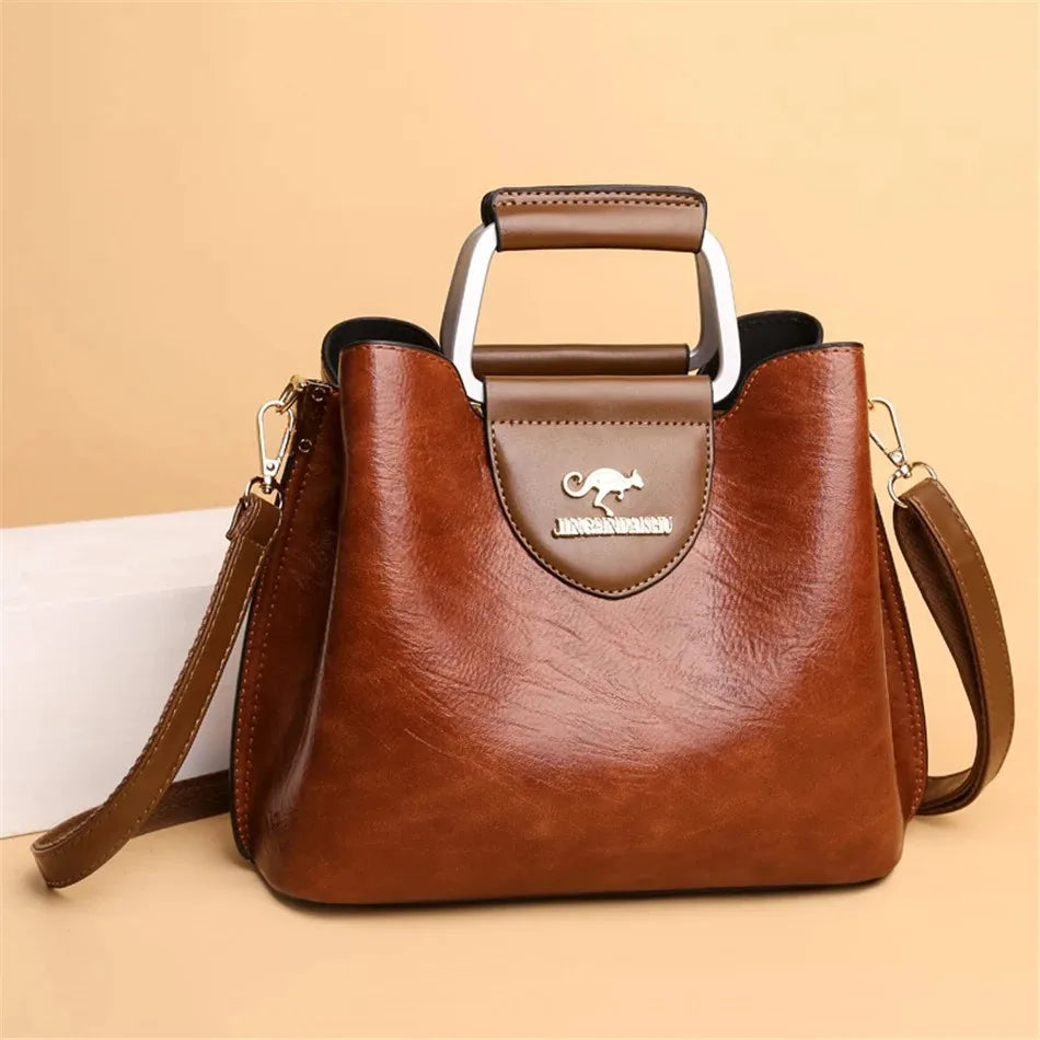Genuine leather women's clutch bag by Corporación Turística, featuring a sleek design with a top handle and elegant finish.