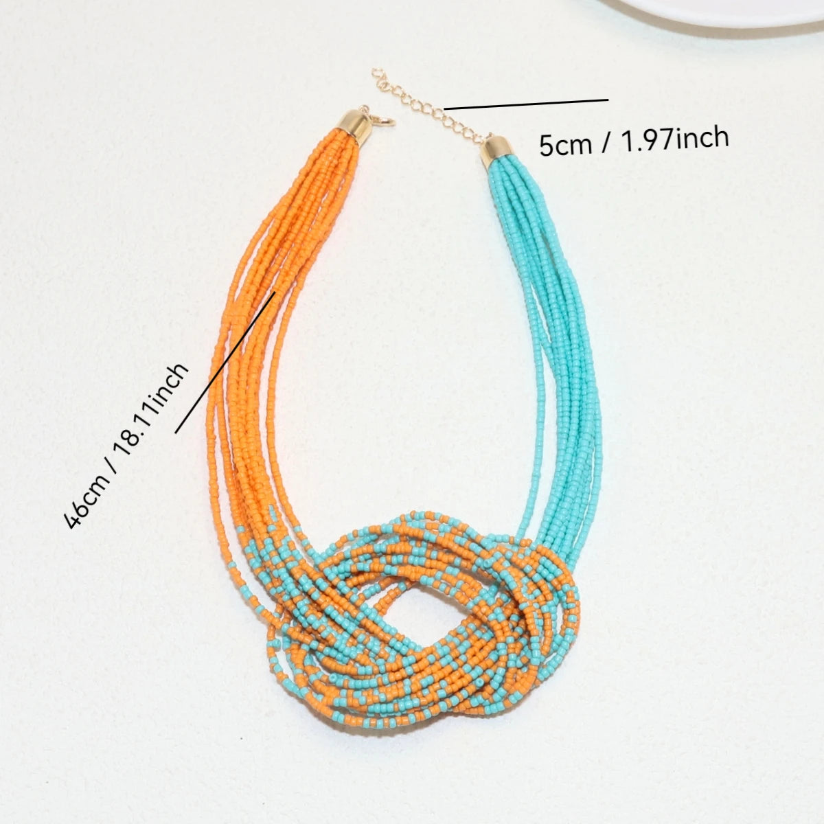 Ethnic-style rice bead necklace from Corporación Turística, featuring colorful, handcrafted design with multiple rice bead strands.
