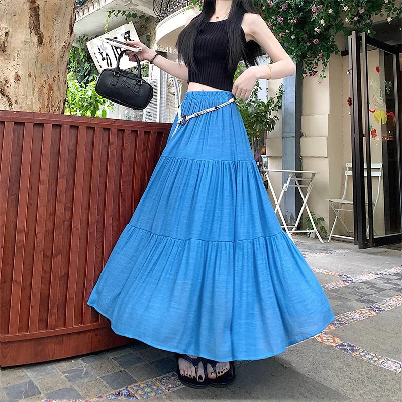 Long boho summer midi skirt made of cotton and linen, featuring a relaxed flowy design perfect for warm weather.