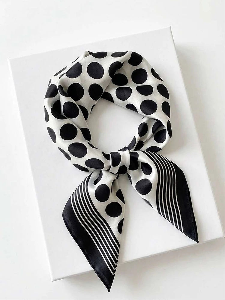 Silk imitation square scarf from Corporación Turística with colorful floral pattern, displayed flat against a white background.