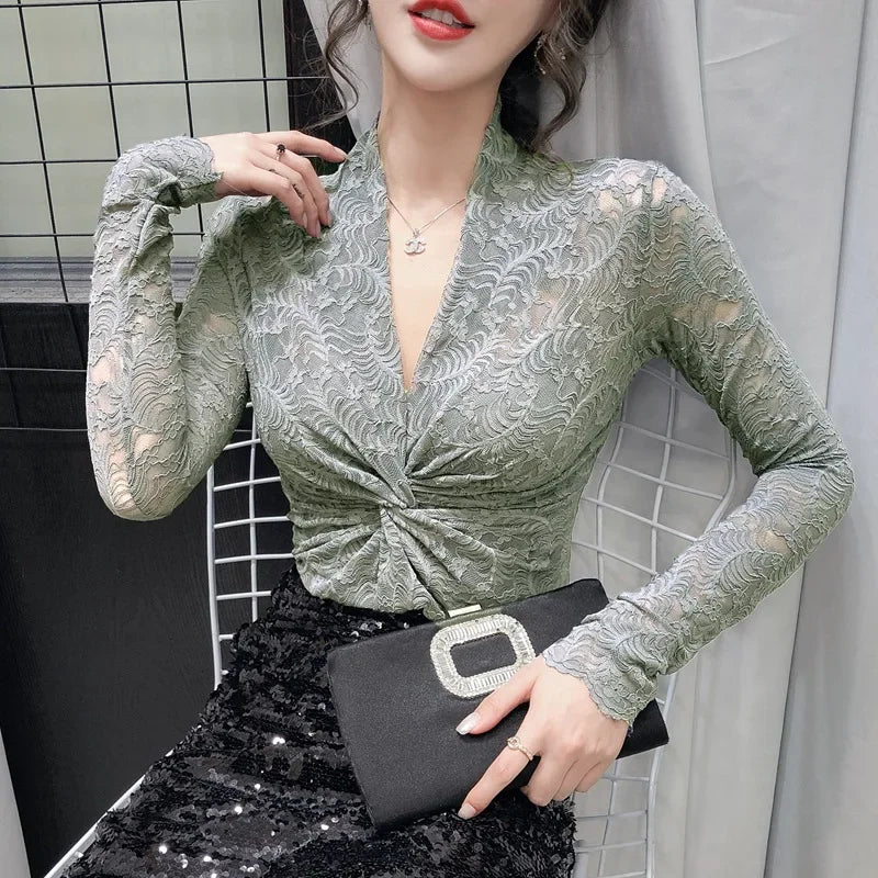 Elegant women's lace blouse with V-neck from Corporación Turística, featuring intricate lace details and a stylish fit.