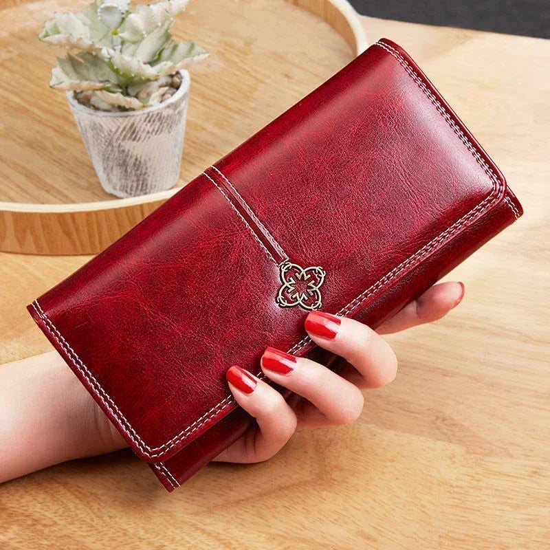 Long leather wallet for women with coin pocket and card slots, stylish and functional leather purse by Corporación Turística.