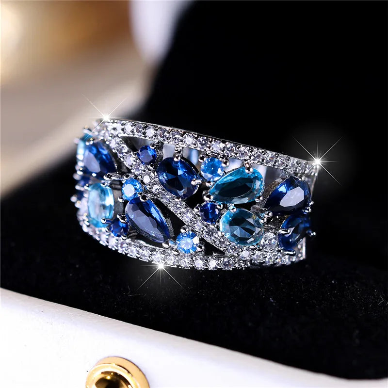 Elegant blue cubic zirconia ring for women showcasing a luxurious jewelry piece with a sparkling gemstone setting.