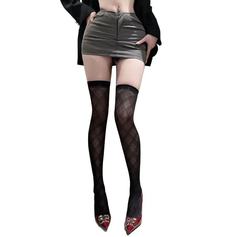 Pair of elegant, minimalist silk socks by Corporación Turística, showcasing smooth fabric and sleek design.