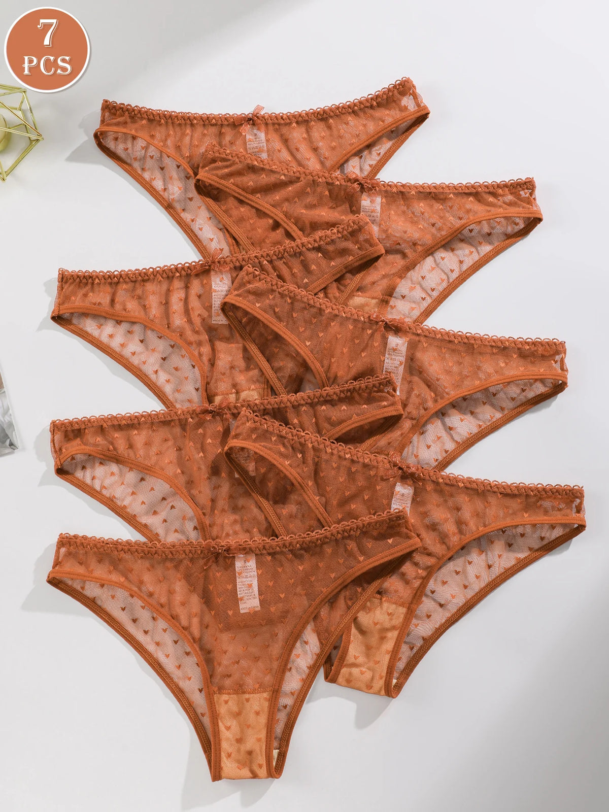 Seven-pack of simple, comfortable triangular women's underwear by Corporación Turística, shown in soft fabric and classic style.