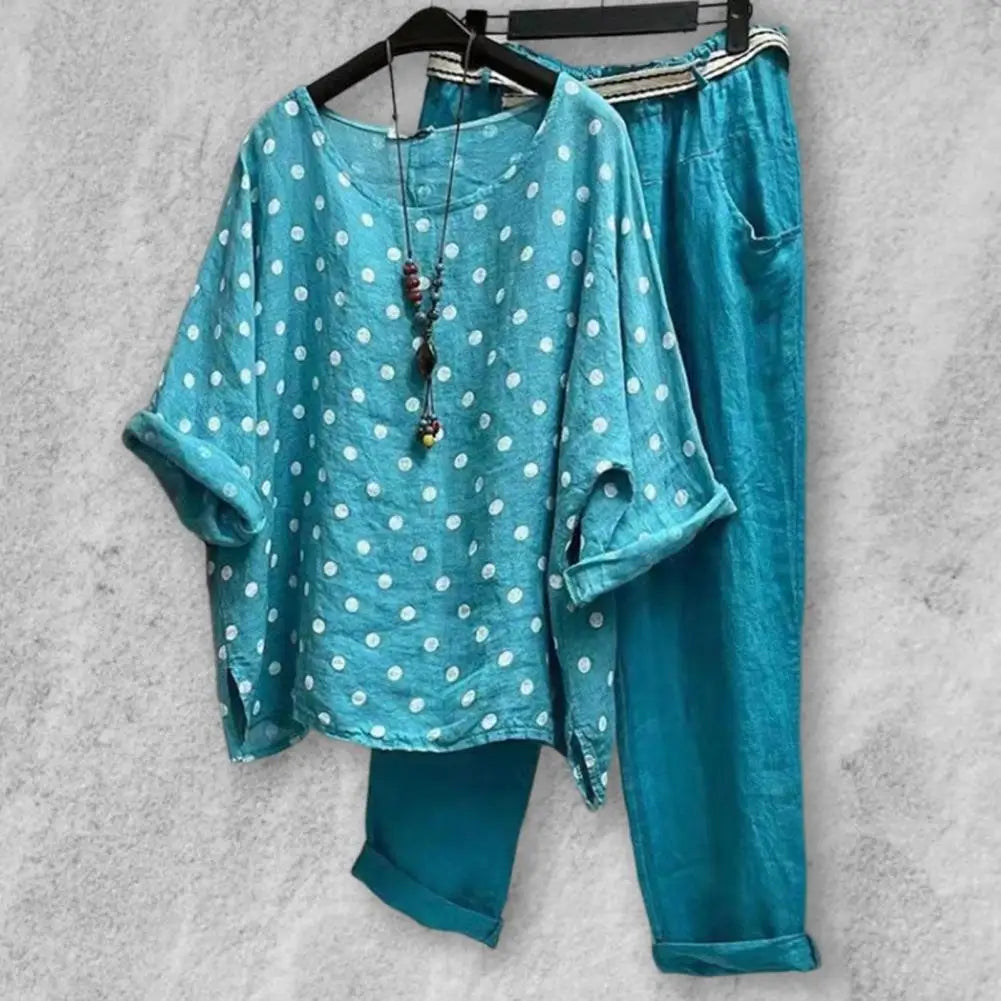 Spring and summer women's outfit featuring a blouse and pants from Corporación Turística, shown in a stylish, casual ensemble.