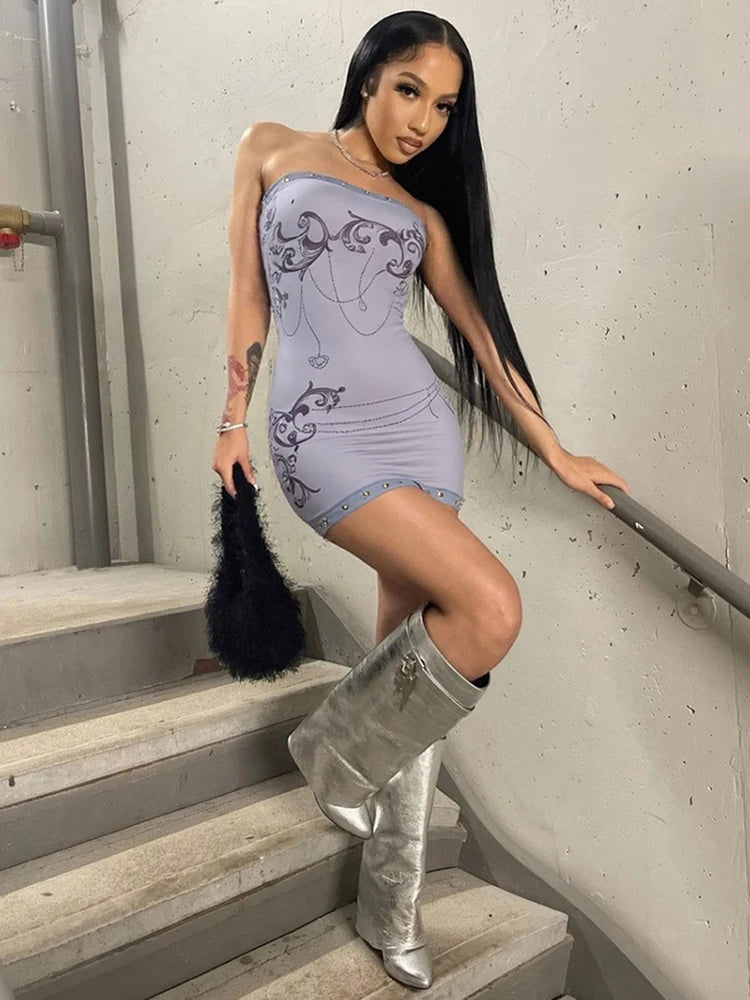 Sexy dress with metal cat ring details, featuring a stylish design and fitted silhouette, ideal for trendy fashion statements.