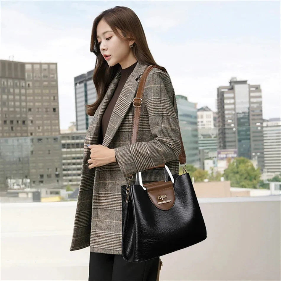 Genuine leather women's clutch bag by Corporación Turística, stylish leather handbag with top zipper and elegant design.