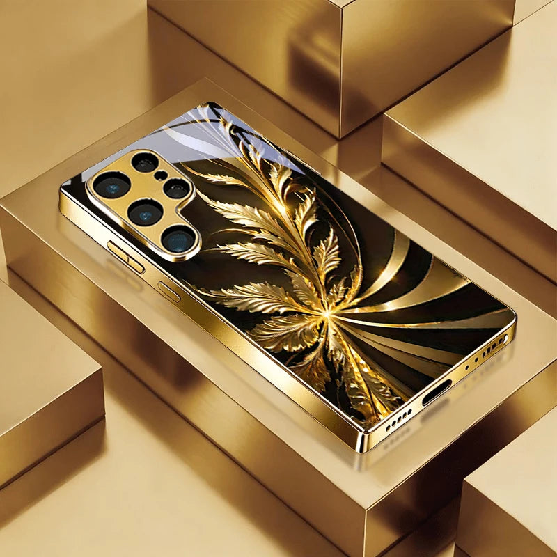 Golden phone case with radiant foliage design, featuring intricate leaf patterns and a stylish protective cover.