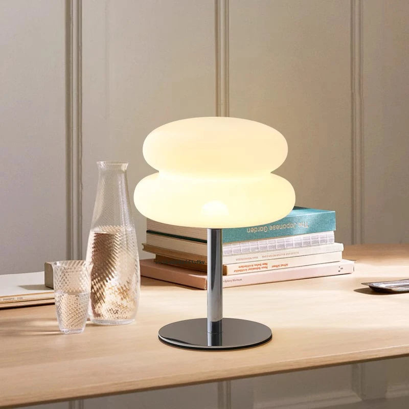 LED mushroom-shaped desk lamp with USB connection, modern design by Corporación Turística, illuminated with a warm glow.
