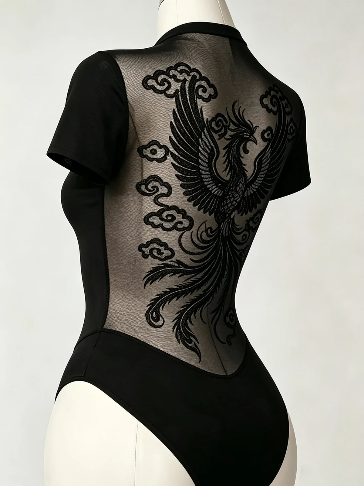 Short sleeve women's body with transparent mesh back by Corporación Turística, showing a fitted design and stylish mesh detail.