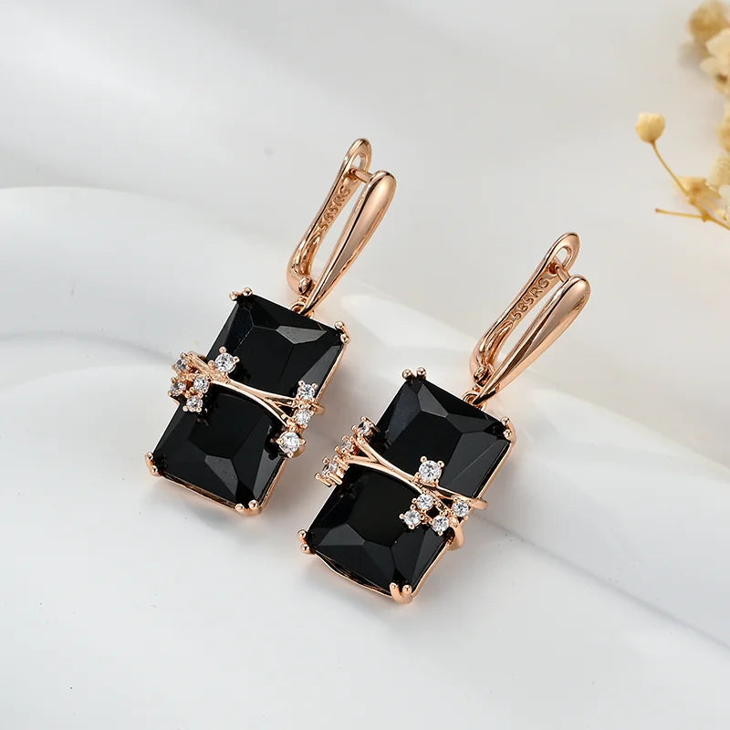 Black square stone dangle earrings by Corporación Turística featuring long, elegant design with geometric style.