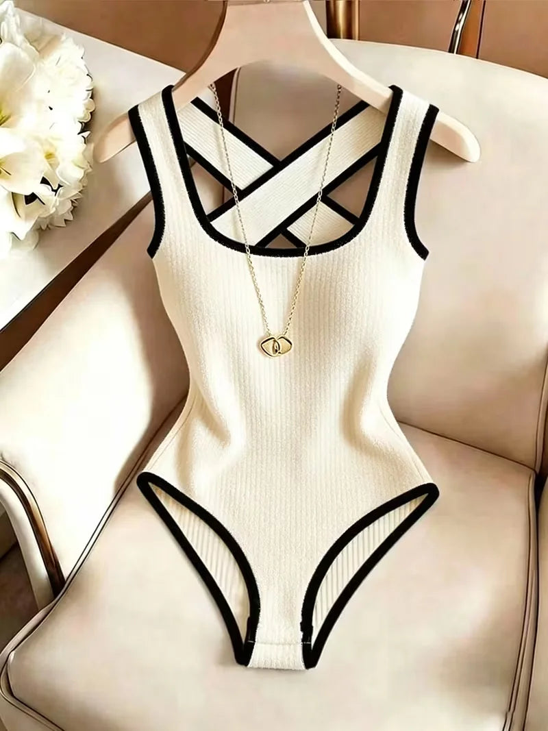 Sleeveless ribbed body suit for women by Corporación Turística, featuring a fitted design and back detail.