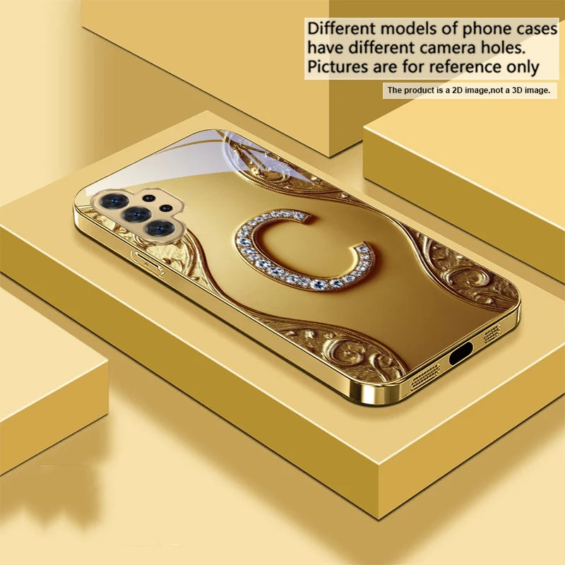 Golden crystal phone case with diamond accents, designed for a sleek and luxurious look on compatible smartphones.