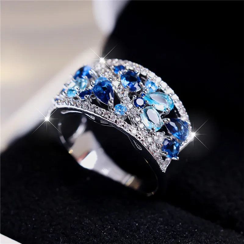 Elegant blue cubic zirconia ring for women, featuring a luxurious design with sparkling gemstone setting.