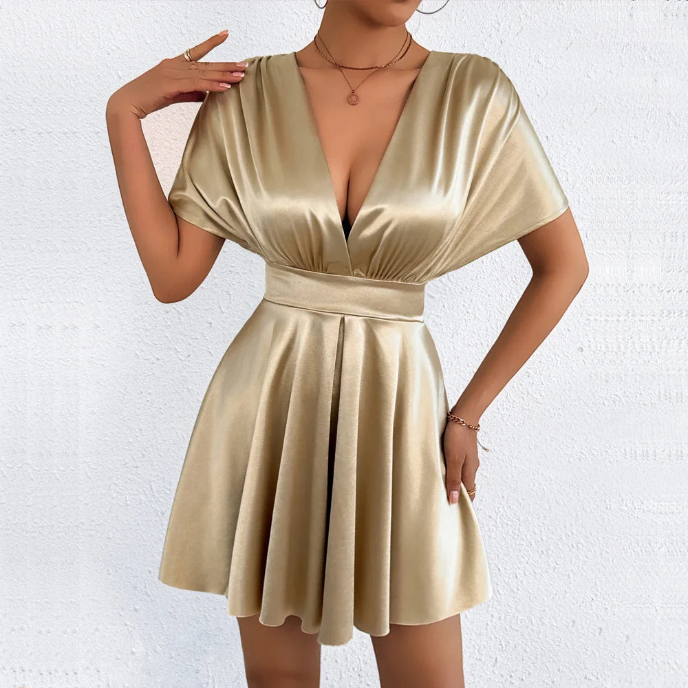 Elegant sexy dress with V-neckline and low waist, featuring stylish design from Corporación Turística.