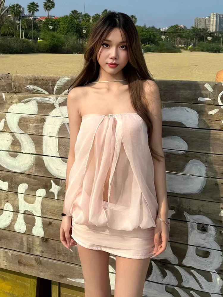 Mini bodycon dress for women by Sisterlinda featuring a cross neckline, stylish and form-fitting, perfect for fashionable occasions.