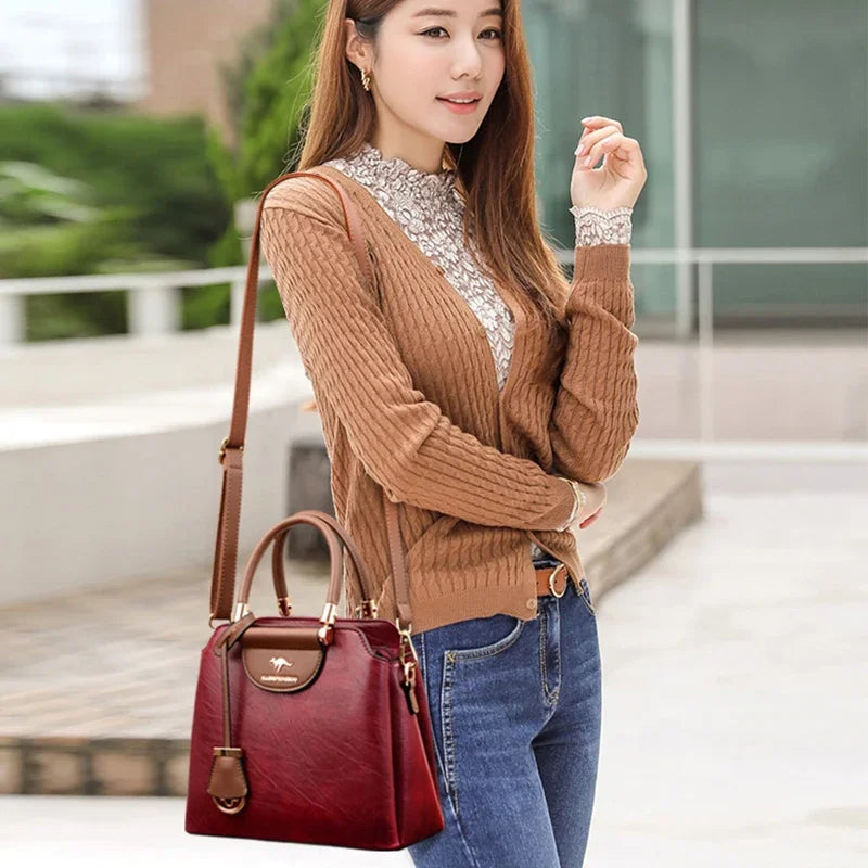 Small leather crossbody bag for women by Corporación Turística, featuring a compact design and adjustable strap.