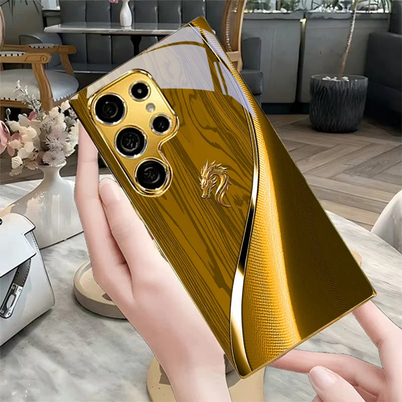 Golden galvanized phone case featuring a dragon design, from Corporación Turística, with intricate detailing and vibrant finish.