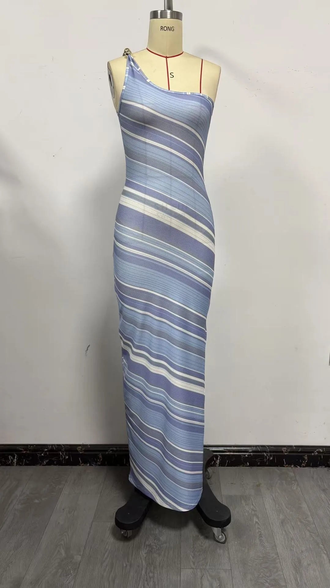 Striped fitted mini dress for women with single shoulder strap, by Corporación Turística, shown on a model.