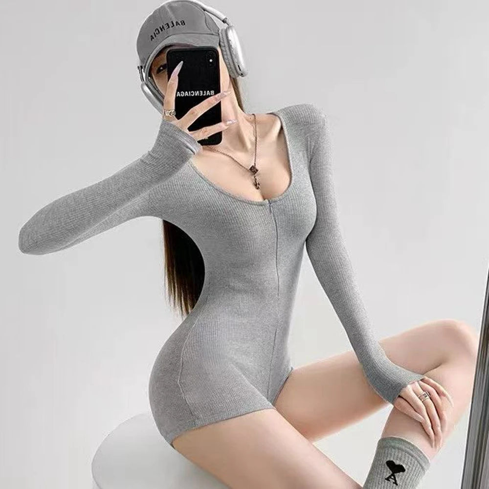 Black women's yoga jumpsuit by Corporación Turística with elastic, fitted design, perfect for active wear and yoga practice.