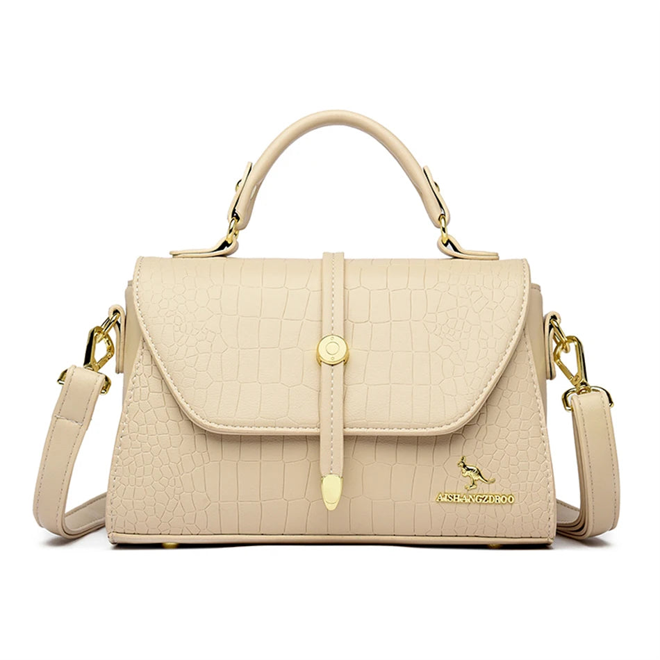 Crocodile leather crossbody bag from 2024 collection, featuring a stylish design and adjustable strap, by Corporación Turística.