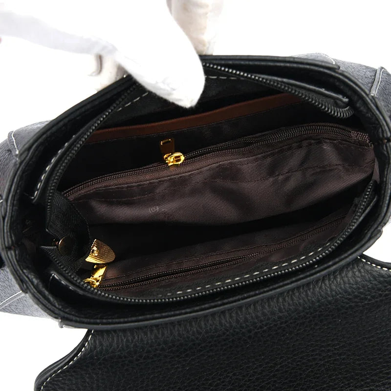 Small high-quality women's shoulder bag by Corporación Turística, stylish bandolera with sleek design and durable material.
